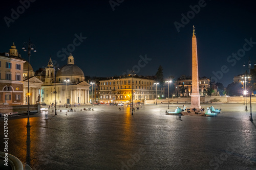 Piazza del Popolo at night in Rome, Italy.