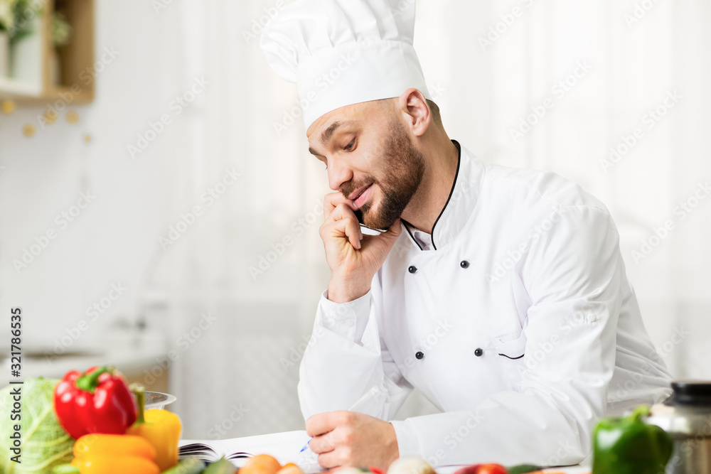 Cook Man Talking On Phone Receiving Order Standing Indoor Cook Man Talking On Phone Receiving Order Standing Indoor