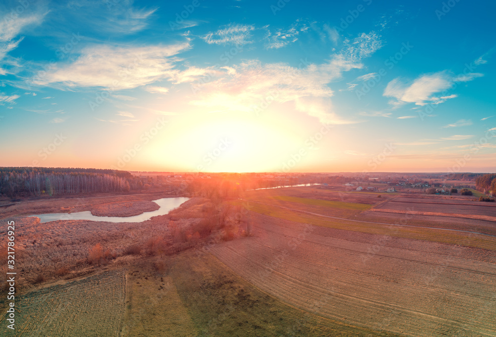 Sunset over the countryside. Rural landscape in autumn. Aerial view