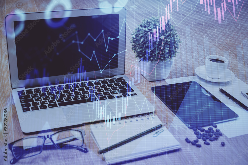 Financial chart drawing and table with computer on background. Multi exposure. Concept of international markets. Financial chart drawing and table with computer on background. Multi exposure. Concept of international markets.
