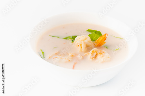 coconut milk soup with shrimp and pak mieng, southern thai vegetable, famous local gourmet on white background photo