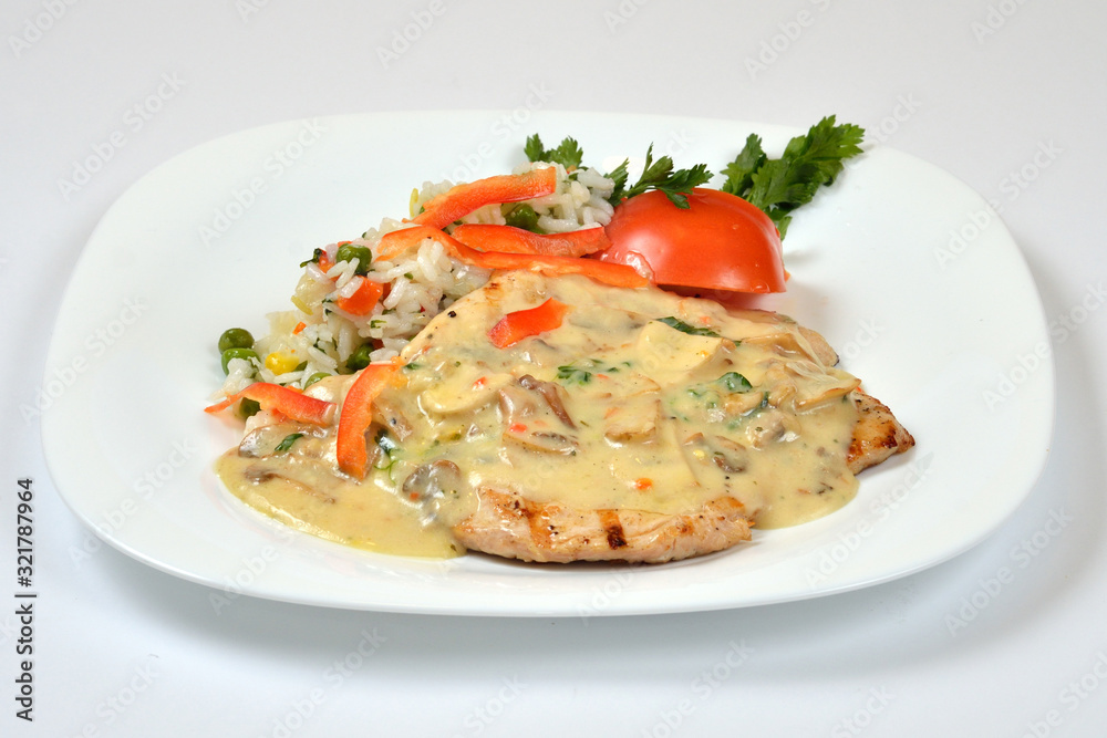 Food from a chicken restaurant with vegetables and sauce. Food from a chicken restaurant with vegetables and sauce.