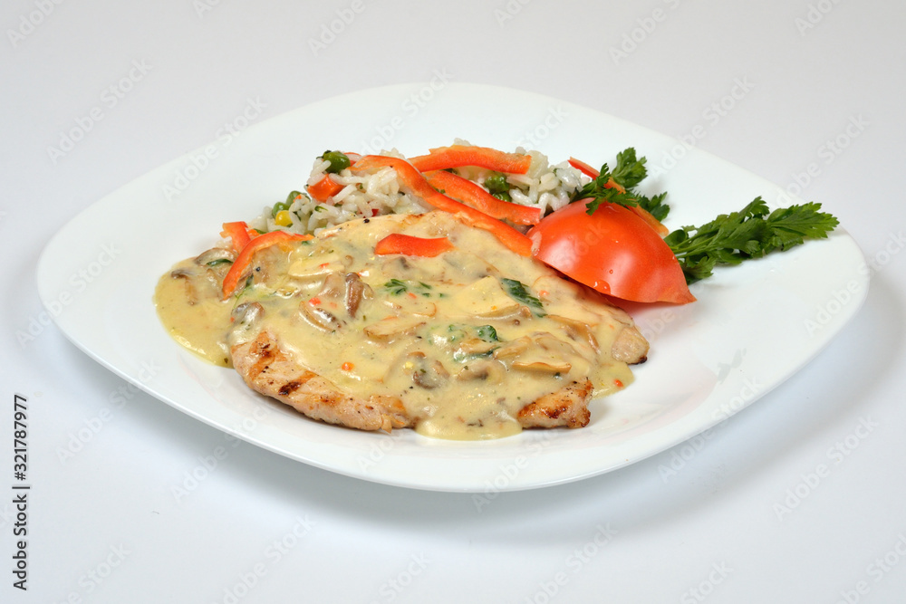 Food from a chicken restaurant with vegetables and sauce. Food from a chicken restaurant with vegetables and sauce.