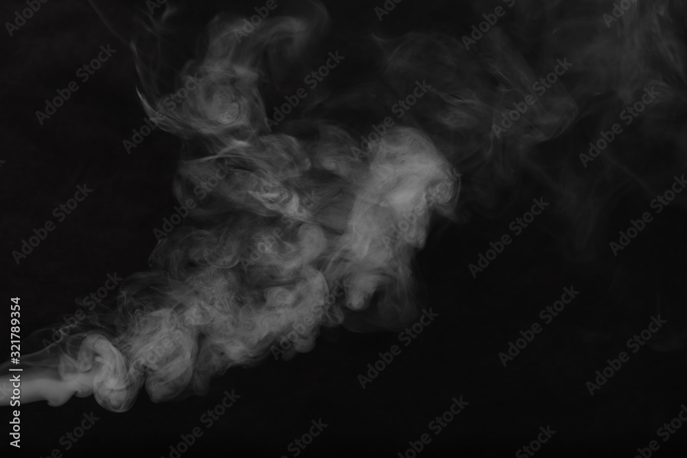 Obraz White smoke on a black background. Texture of smoke. Clubs of white smoke on a dark background for an overlay