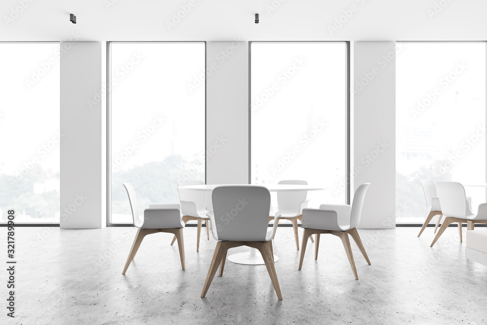 Loft white cafe interior with round tables