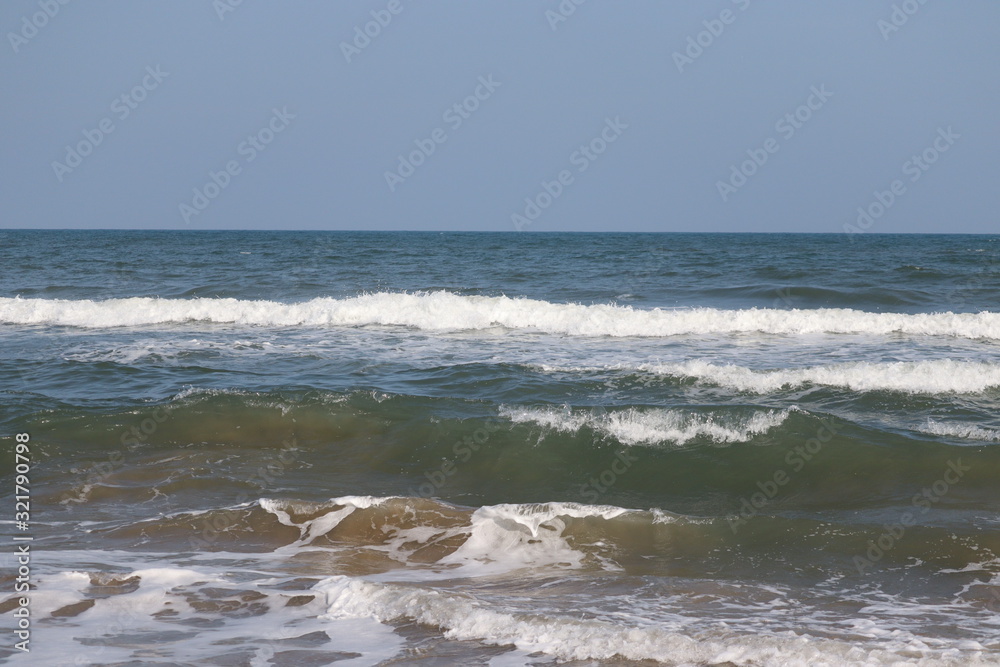 Soft wave of blue ocean on sandy beach.Summer beach and sea, marina beach