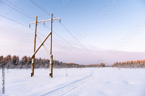 Power transmission line in winter snowy day. Electricity transportation © Iurii