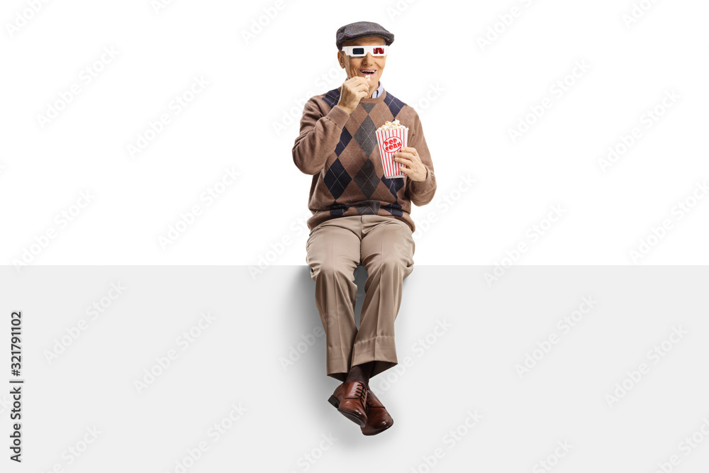 Elderly man on a panel with popcorn and 3d movie glasses