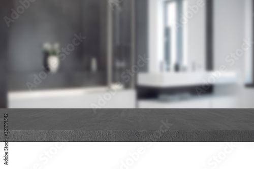 3D Render artwork of empty gray concrete table top (desk) for product display with blurred bathroom interior background