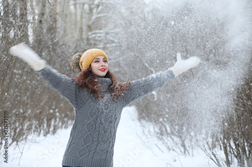 Beautiful girl in a beautiful winter park