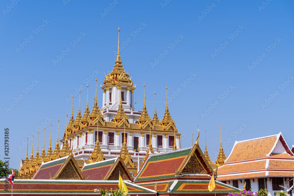 Fototapeta premium Loha Prasat or iron monastery at Wat Ratchanatdaram temple, on Ratchadamnoen avenue, Bangkok, Thailand