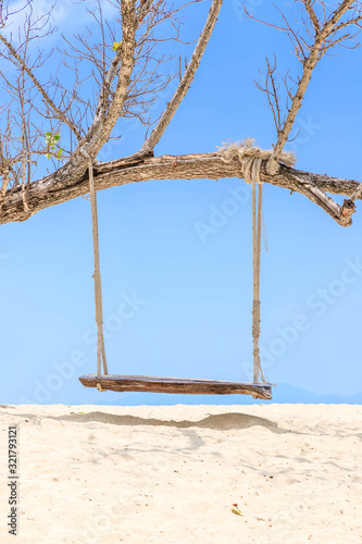 Wooden swing hang under tree at Koh Phak Bia Island, Krabi, Thailand photo