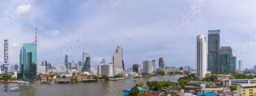 Bangkok city center financial business district, waterfront cityscape and Chao Phraya River during sunny day