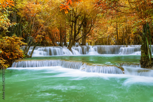 Fototapeta Naklejka Na Ścianę i Meble -  Colorful majestic waterfall in national park forest during autumn - Image