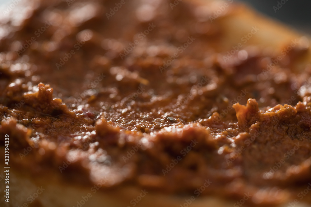 Closeup ciabatta with red pesto sauce Closeup ciabatta with red pesto sauce