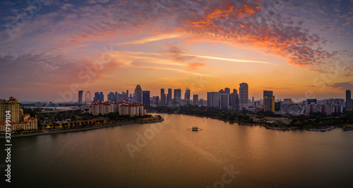Kallang river overlooking at the stadium and Singapore skyline during sunset © Huntergol