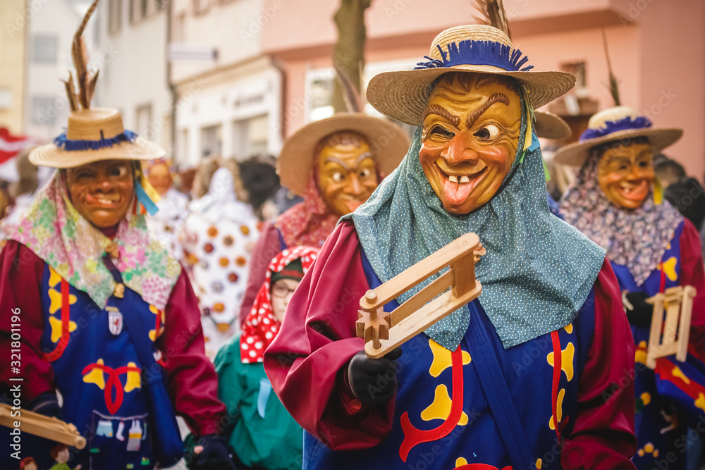 Fototapeta premium Festival participants dressed up in handmade costume and mask at the Ulmzug carnival event in Ulm, Germany