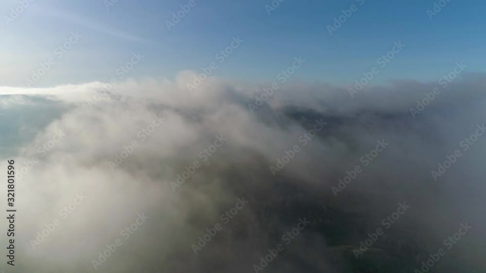 Scenic aerial view of moving white clouds. Scenic aerial view of moving white clouds.