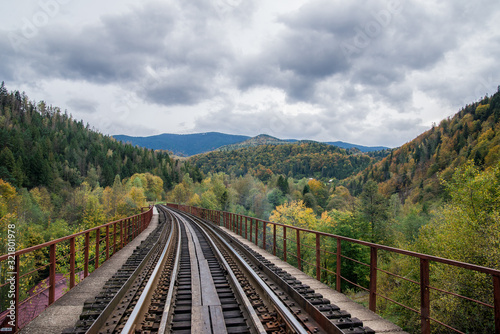 railroad in the mountains in the forest on a journey in nature