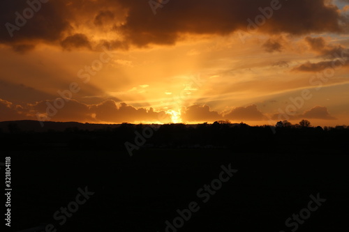 Orange sunset over the hill © Alex
