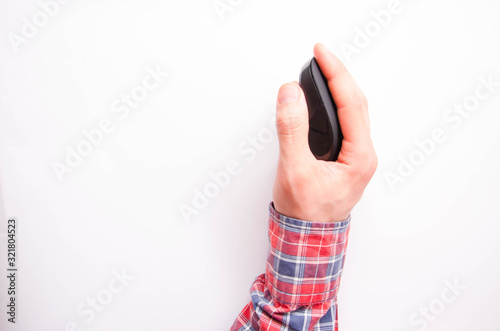 Wireless, bluetooth black mouse in male hand on a white background. Hand sideways, straight, hand on top. Different angles. Wireless computer mouse on a white background in macro side view.Copy Space