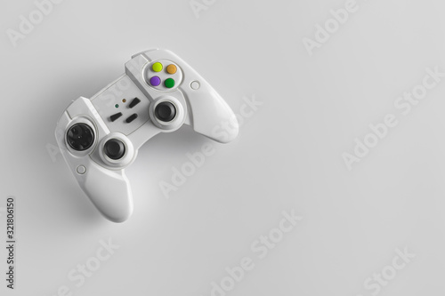 White wireless gamepad for playing video games. Joystick or game controller on a white background.