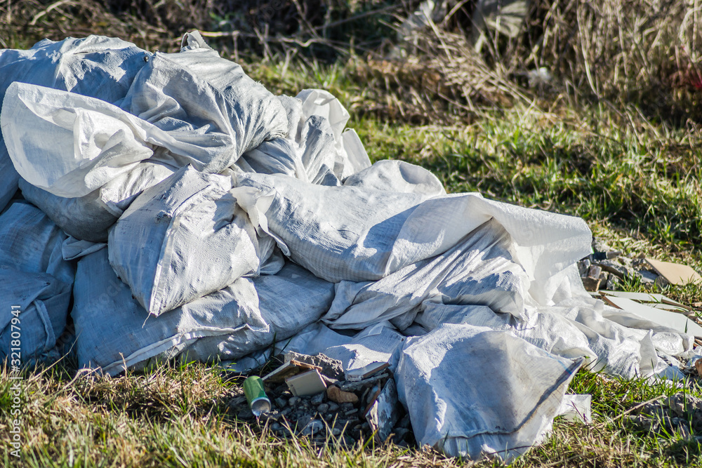 Piles of garbage in white wicker, plastic bag Piles of garbage in white wicker, plastic bag