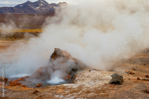 Steam of one of the beautiful El Tatio geysers at sunrise, Chile. Located at 4,320 meters above the sea level El Tatio geyser valley is one the highest elevated geyser field in the world.