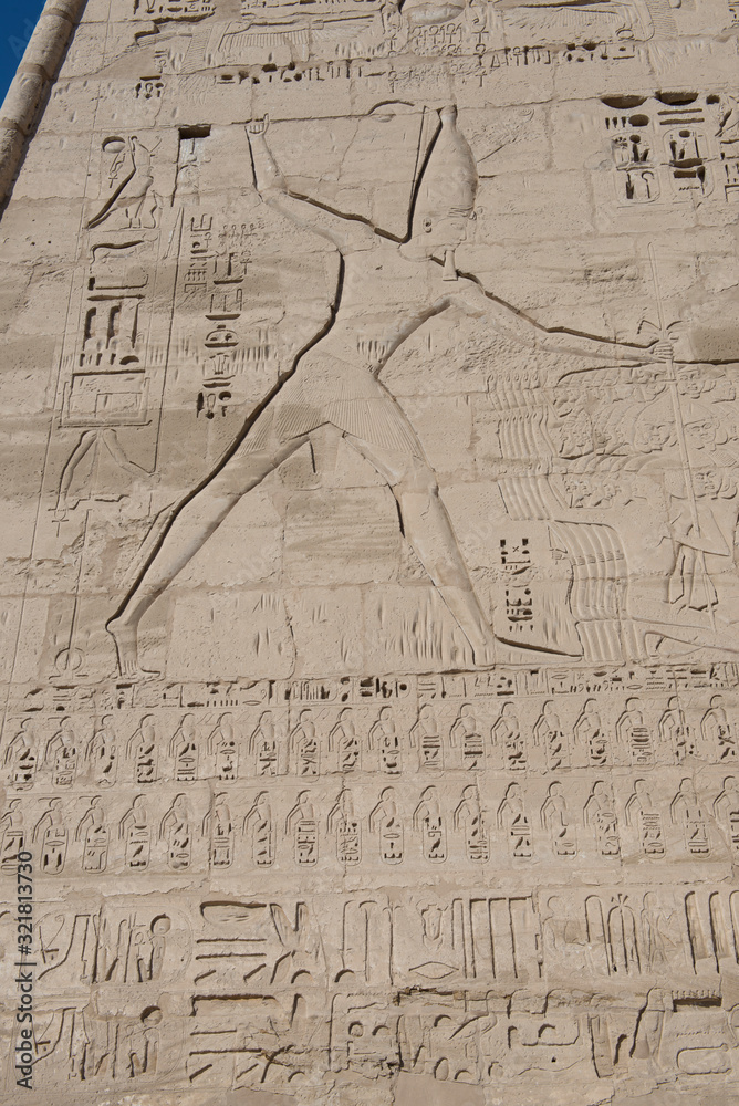 Hieroglyphic carvings on an ancient egyptian temple wall Stock Photo