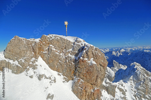 Zugspitze mountain is the highest point of Germany. Scenic view with summit cross