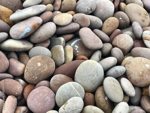 Pebbles at the beach with blue colour