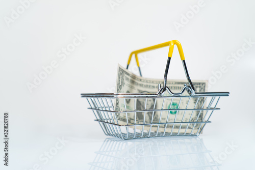  one dollar in a supermarket basket concept of payment for goods 