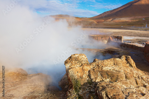 Beautiful El Tatio geysers at sunrise, Chile. Located at 4,320 meters above the sea level El Tatio geyser valley is one the highest elevated geyser field in the world