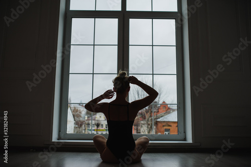 woman sitting on windowsill