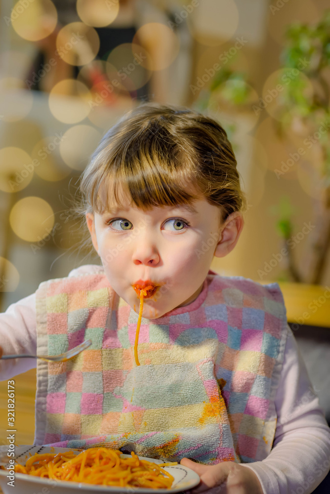 cute little girl eating spaghetti bolognese cute little girl eating spaghetti bolognese
