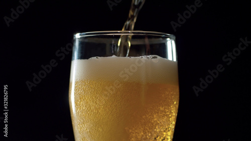 Beer pouring into the glass