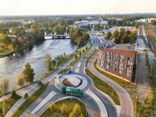 Aerial view of the brand new modern apartment building. On the foreground roundabout. 