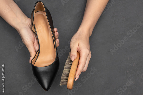 Leather shoes care concept. Shoe cleaning and polishing background with free copy space photo