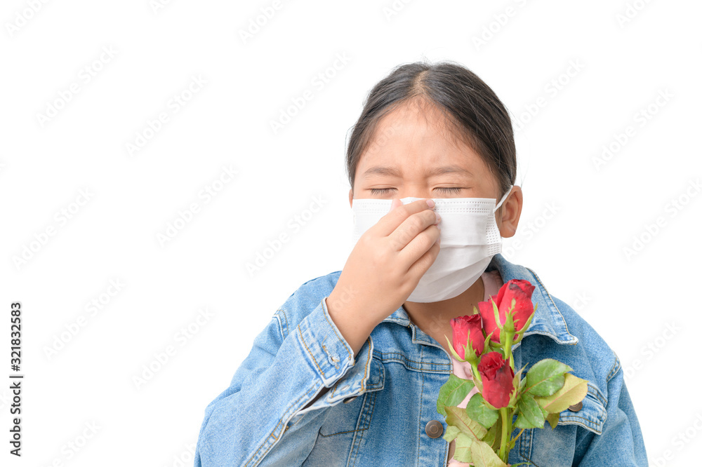 Child with a mask to prevent allergy and holding red rose Child with a mask to prevent allergy and holding red rose