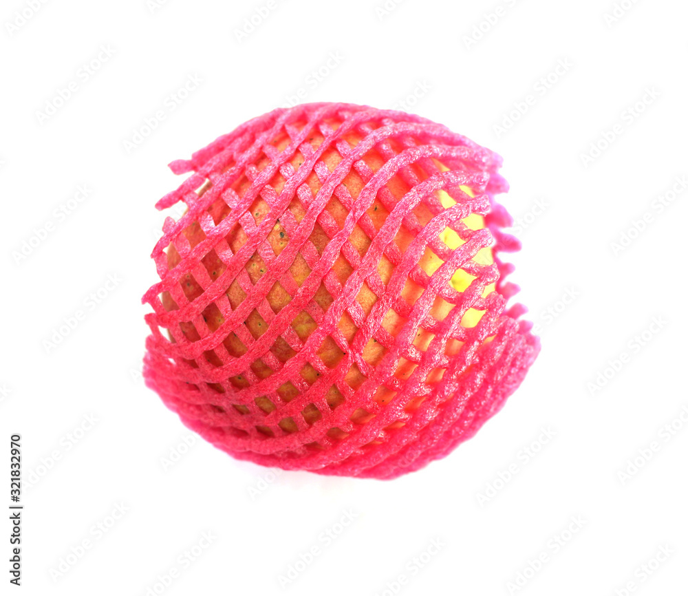 apple wrapped with foam plastic mesh net cushion isolate on white background apple wrapped with foam plastic mesh net cushion isolate on white background