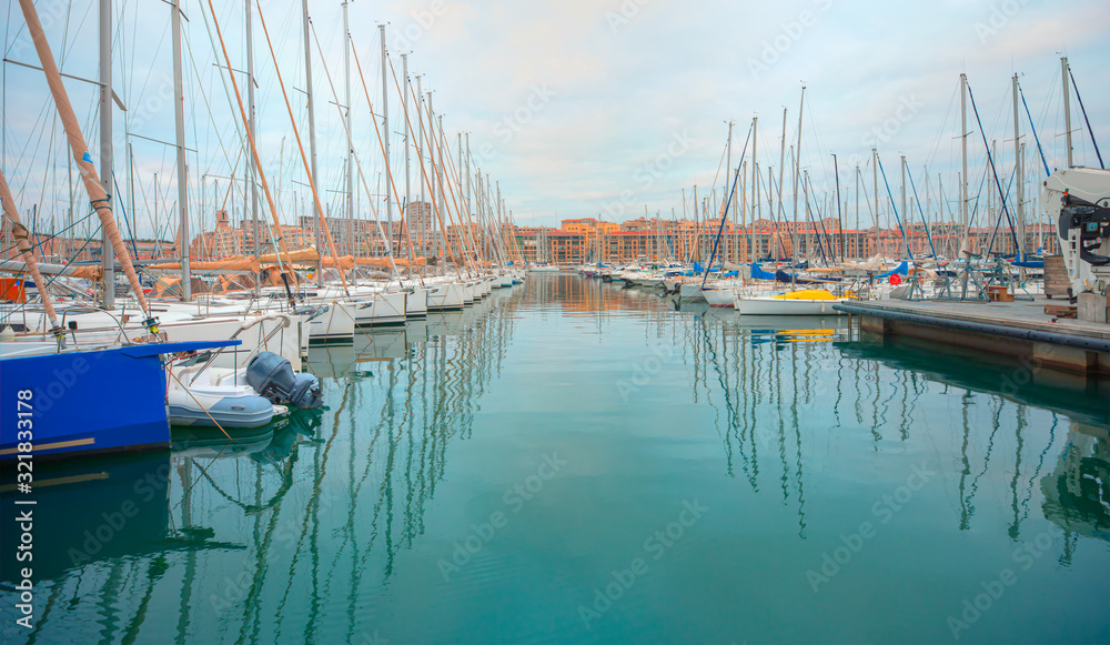 Fototapeta premium Panoramic view of the old port with marina and lot of yacht in the background colorful building