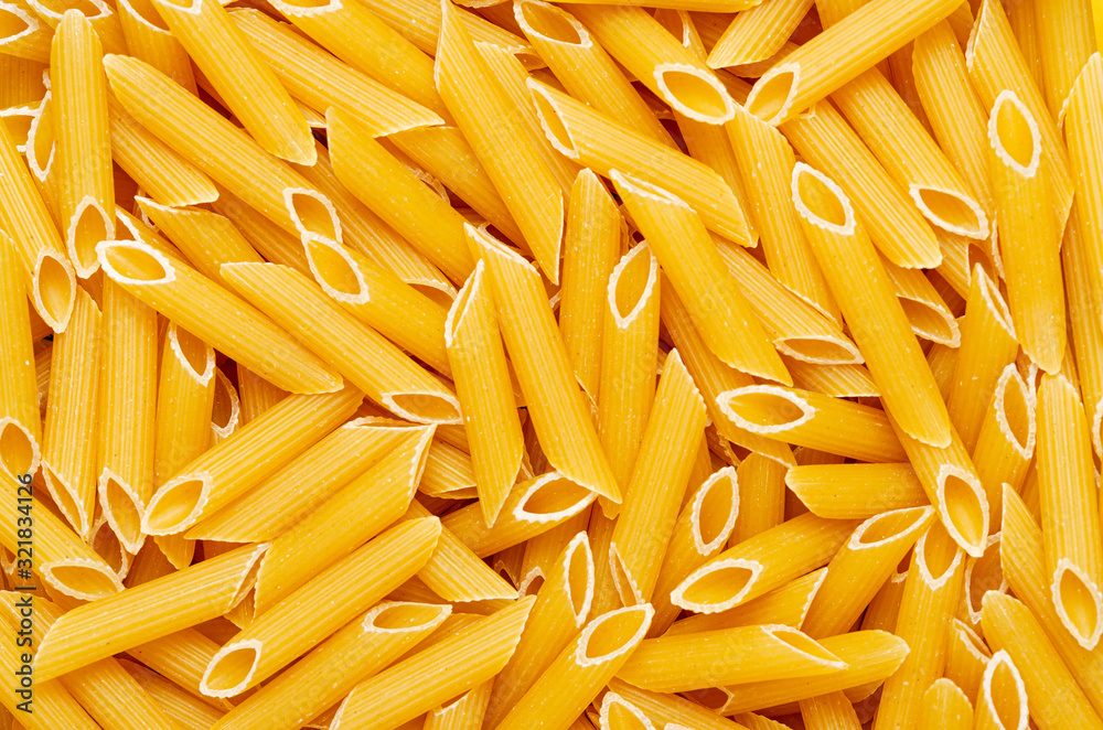 Pasta textured background for menu, website, postcard, decoration. Traditional Italian raw durum wheat pasta Pasta textured background for menu, website, postcard, decoration. Traditional Italian raw durum wheat pasta