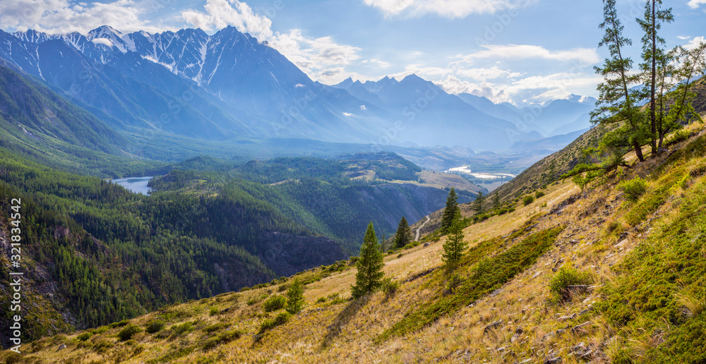 Scenic panoramic view of a mountain valley, summer in the Altai Mountains Scenic panoramic view of a mountain valley, summer in the Altai Mountains