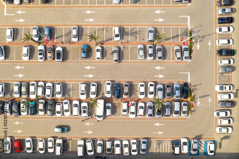Top down aerial view of traffic in a shopping centre Parking lot.
Top down aerial view of traffic in a shopping centre Parking lot.