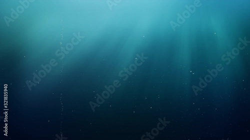 Relaxing tranquility effect background of ocean blue marine water with sunlight rays and bubbles rising in an aquatic abyss