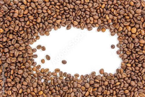 Roasted coffee beans scattered on a white background