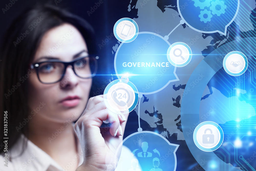 Business, Technology, Internet and network concept. Young businessman working on a virtual screen of the future and sees the inscription: Governance