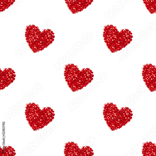 Seamless pattern with red hearts on a white background. Shiny hearts made of beads. Valentines day concept.