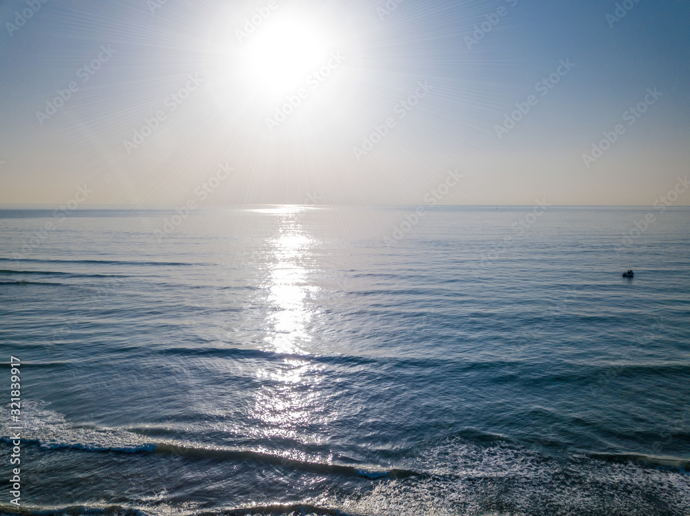 Obraz premium Aerial view of sunset over the sea photos taken by the drone