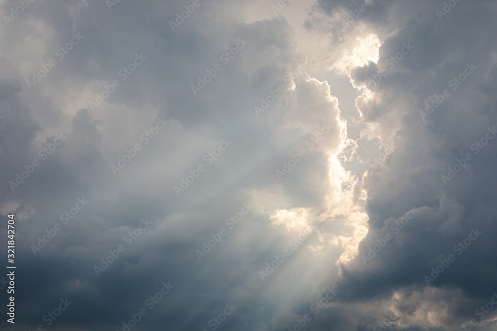 Sunbeam between storm clouds cloudscape sky